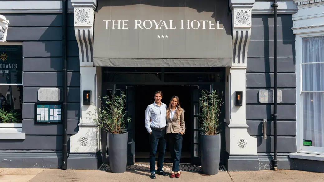 The new owners of The Royal Hotel Bideford standing outside the main entrance doors