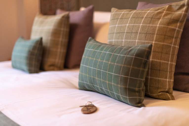 Room Key on Bed in Room 104 