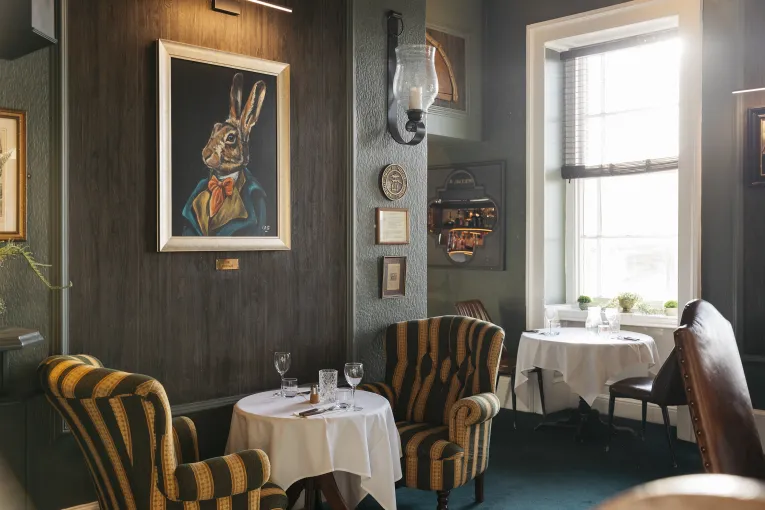 Tables and chairs inside the Merchants Bistro at The Royal Hotel Bideford