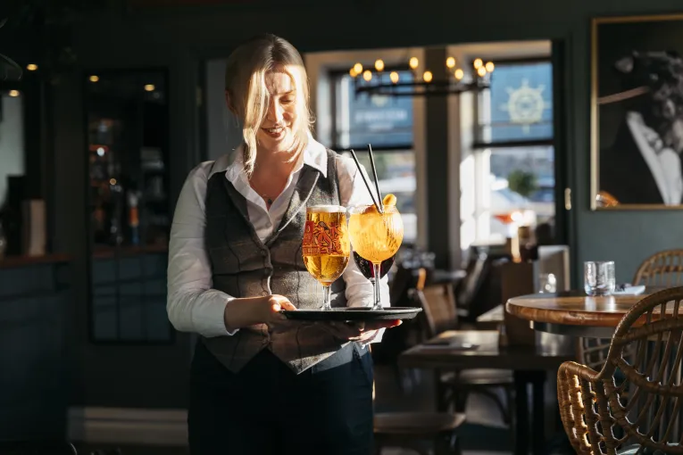 Drinks being delivered to the table by one of the team at The Royal Hotel Bideford