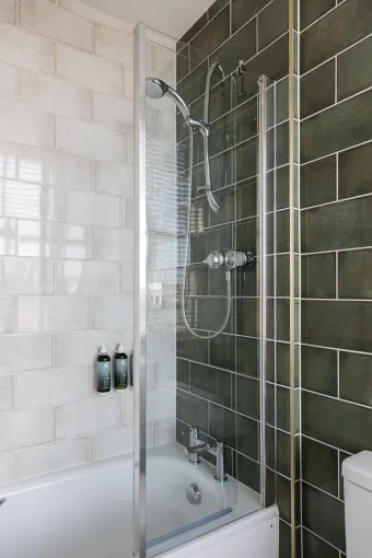 An over-bath shower in one of the guest bedroom en-suites at The Royal Hotel Bideford