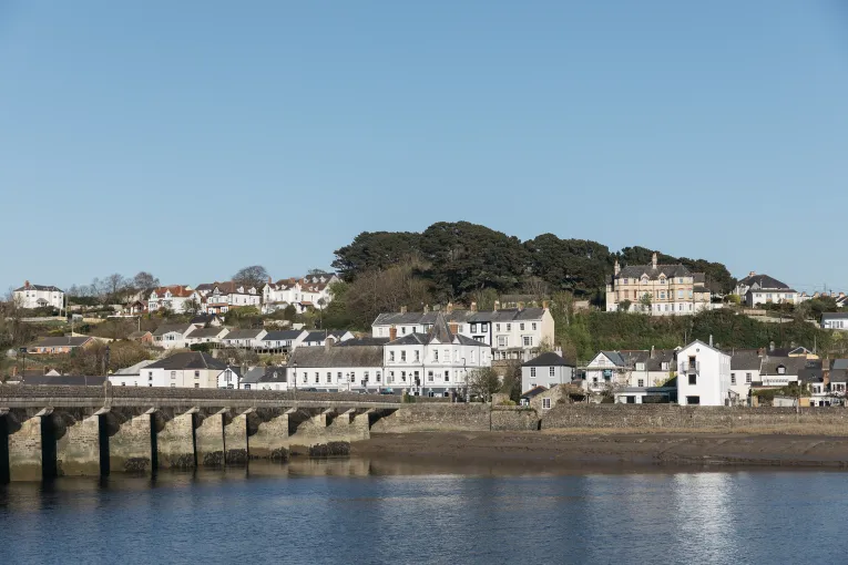 An exterior view of the Royal Hotel Bideford and the bridge from across the other side of the river
