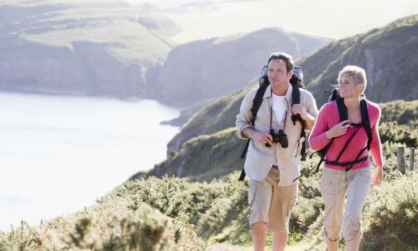 couple walking on coastal path