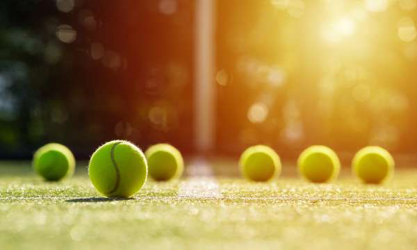tennis balls on grass