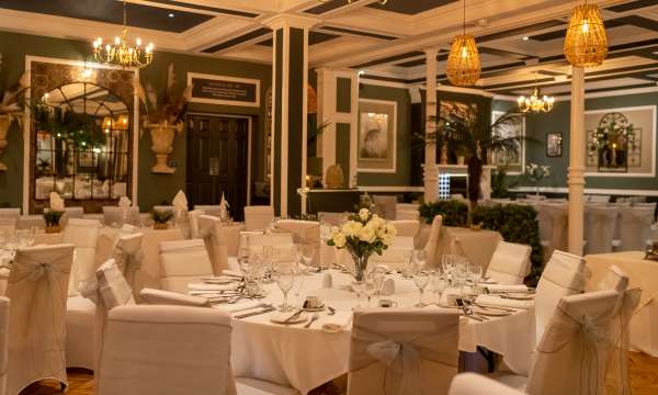 table laid up for a wedding in Palm Court