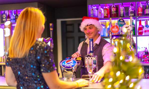 Lady being served in Merchants Bistro Bar