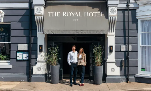The new owners of The Royal Hotel Bideford standing outside the main entrance doors