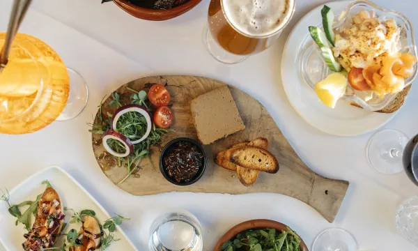 A top-down view of a selection of meals and drinks on a table at The Royal Hotel Bideford