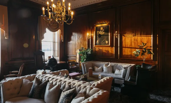 Sofas, chairs and tables in the wood-panelled Kingsley Lounge inside The Royal Hotel Bideford