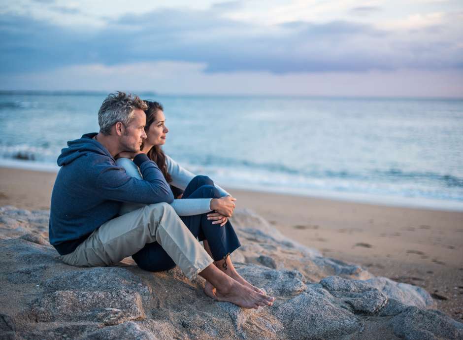 Couple Relaxing by the Sea