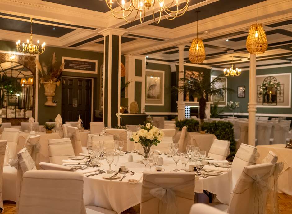 table laid up for a wedding in Palm Court