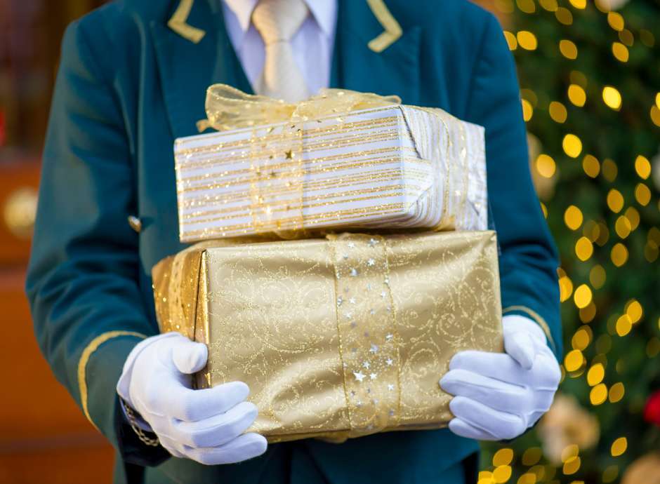 Door man Holding Christmas Presents 