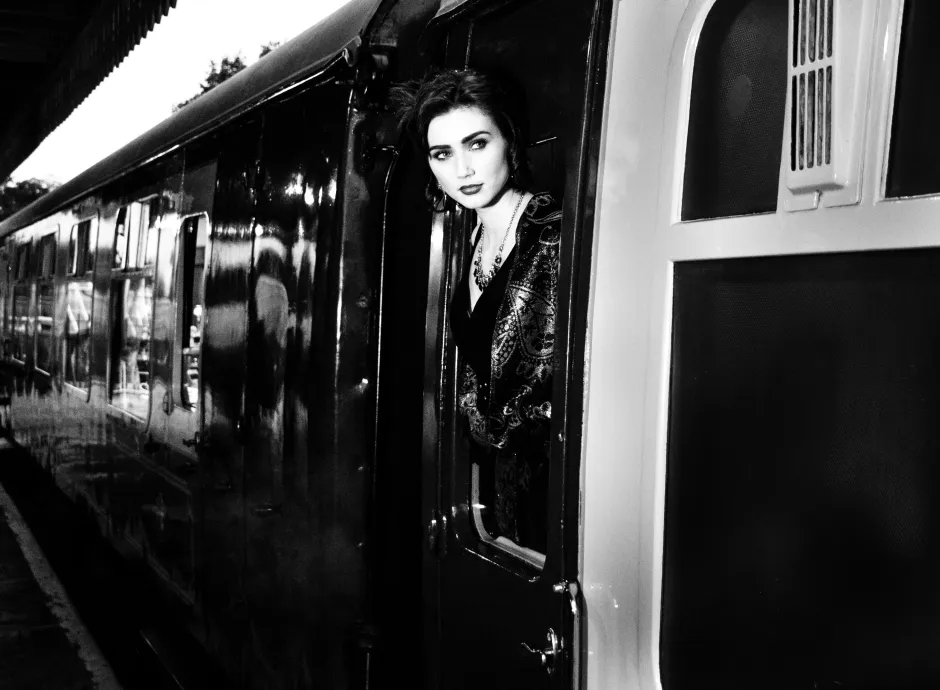 Woman boarding vintage train
