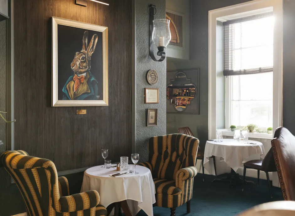 Tables and chairs inside the Merchants Bistro at The Royal Hotel Bideford