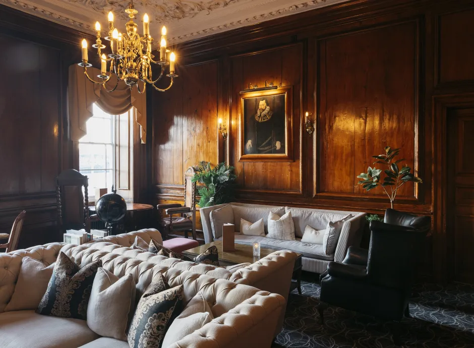 The wood-panelled Kingsley Lounge guest seating area inside The Royal Hotel Bideford