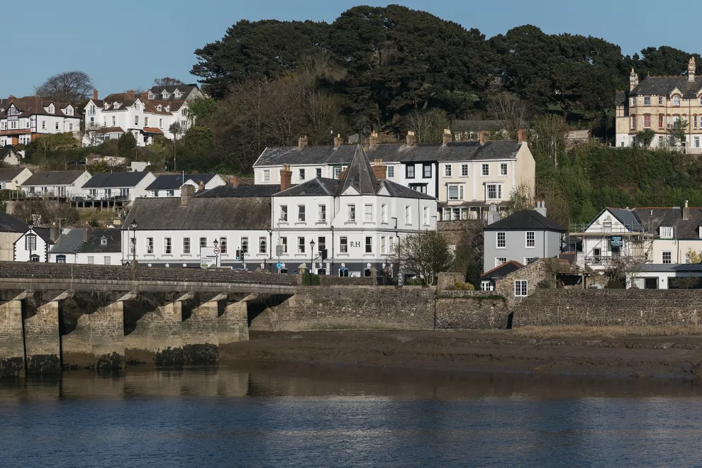 An exterior view of the Royal Hotel seen from across the river