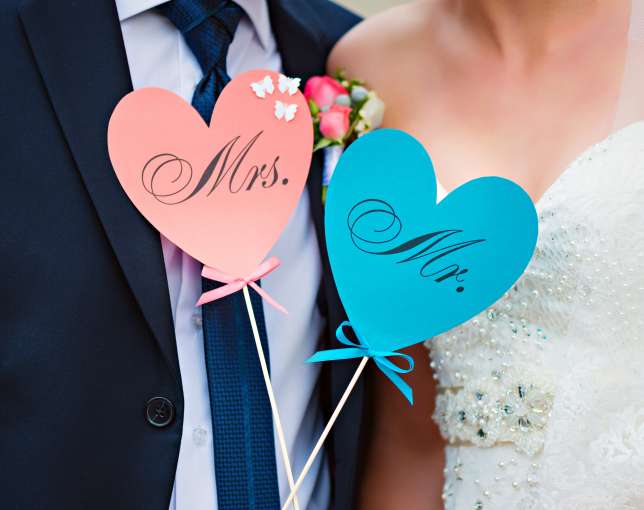 Bride and groom with heart signs